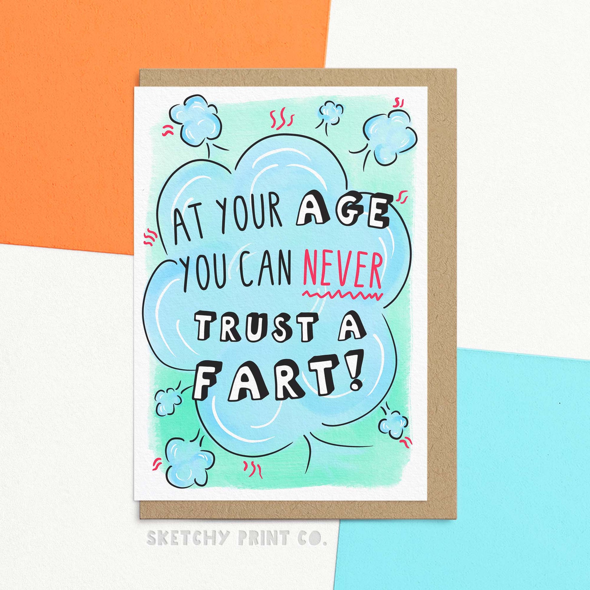 Funny birthday card with text 'at your age you can never trust a fart!' in fun lettering surrounded by illustrated fart cloud. Shown with Kraft envelope.