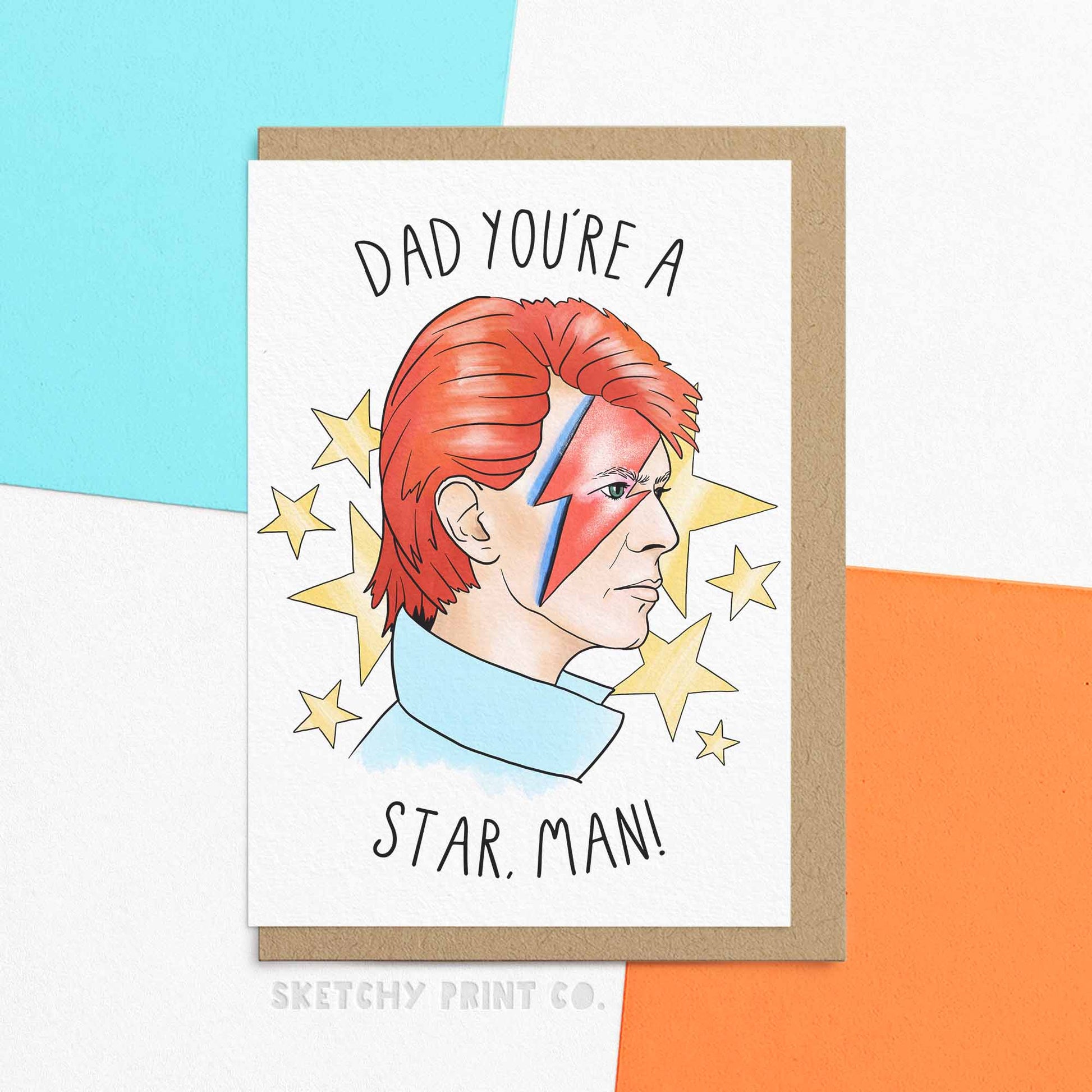Bowie watercolour illustration card saying 'Dad you're a star, man!' Rock your dad's world with our funny Father's Day card! Designed for the ultimate idol dad, this card could even be a happy birthday greeting for your father, letting him know he's a star man! Father jokes aside, if your dad takes care of the spiders from Mars, pair our card with unique Father's Day gifts that will sprinkle some stardust on his special day!
