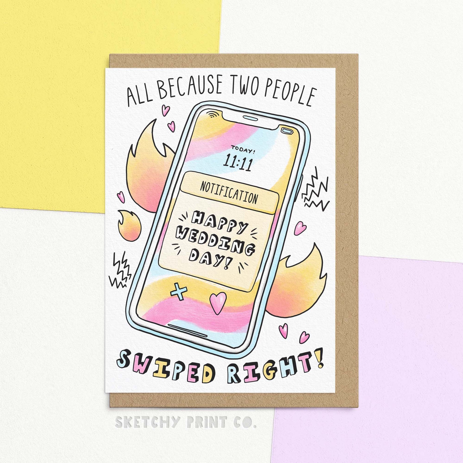 Modern funny wedding card featuring phone illustration and 'swiped right' online dating joke. Text: 'Happy Wedding Day!' 'All because two people swiped right!'. Shown with envelope.
