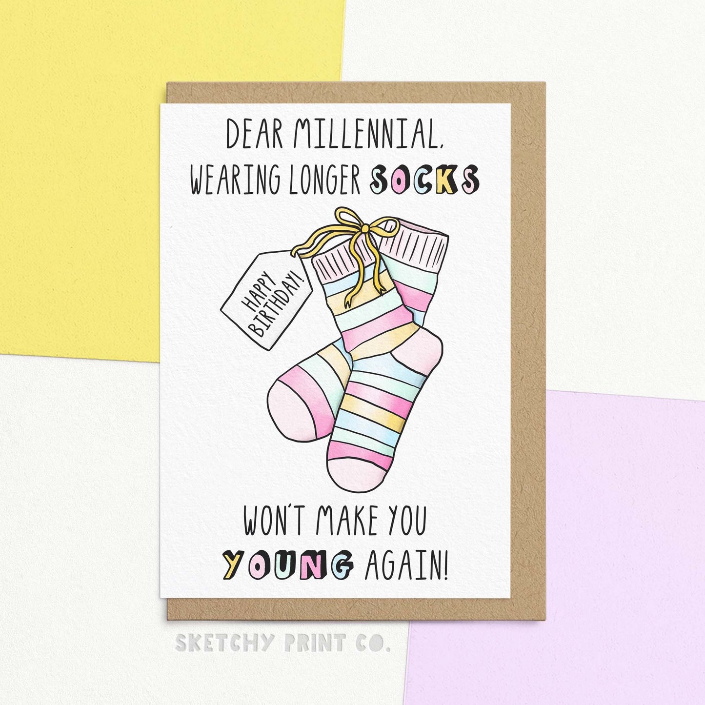 Funny birthday wishes for best friend or sibling. Card Reads Dear millennial, wearing longer socks won't make you young again! With an illustration of socks with a tag saying Happy Birthday!