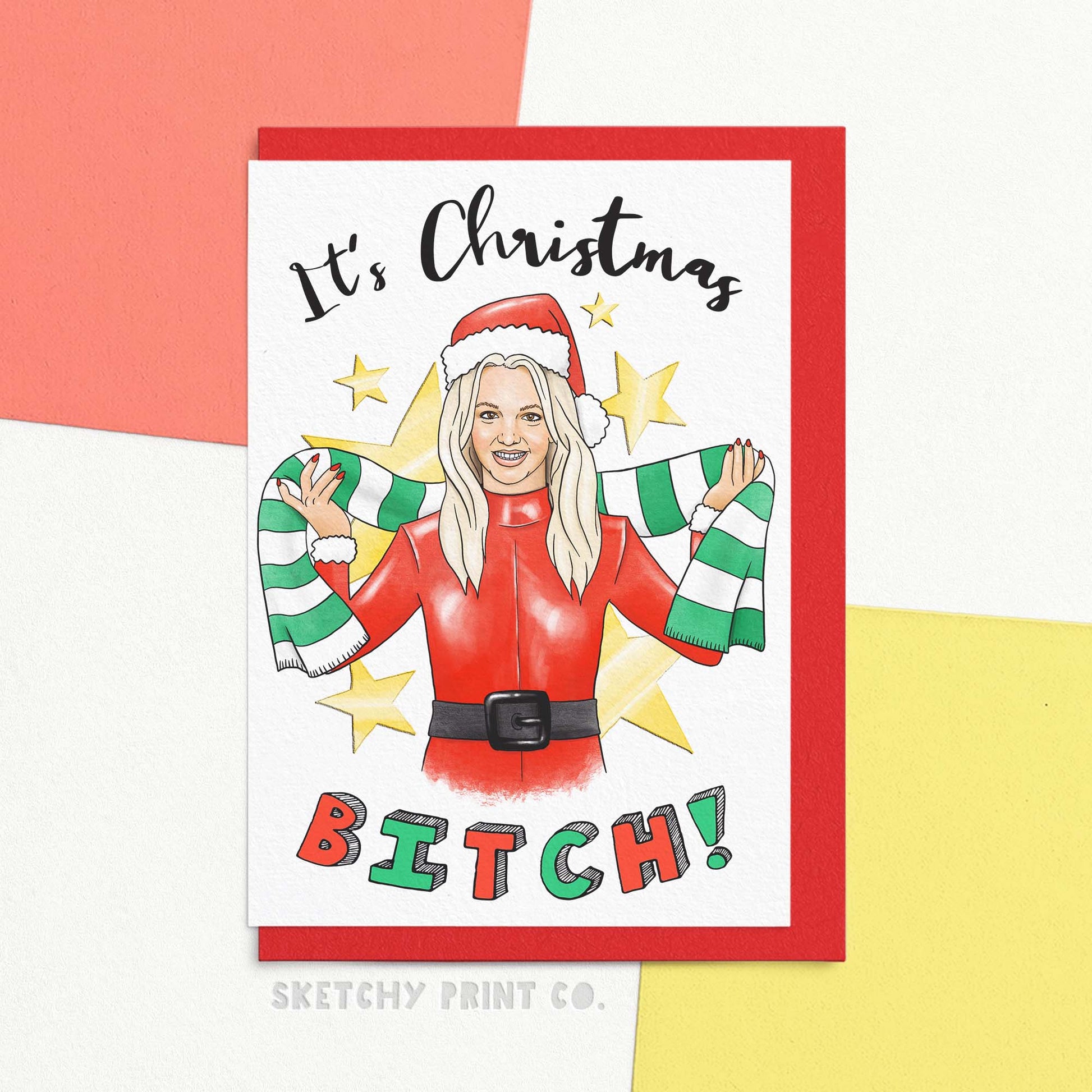 Funny Christmas wishes card reading it's Christmas B*tch! with an artists interpretation of a 90s icon wearing a Christmas hat and scarf. Wish your bestie merry Christmas wishes with this hilarious card that says it all: It's Christmas b*tch! Perfect for a playful and fun-loving friendship, this rude Christmas card will certainly bring some laughs and festive cheer. Spread the holiday spirit with a touch of sass.