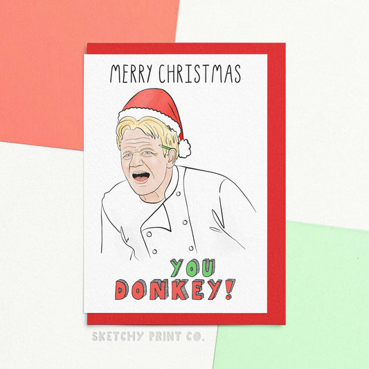 Funny Christmas wishes card saying merry Christmas you donkey! With an artists interpretation of a celebrity chef. Celebrate the holidays with some humour with this funny Christmas wishes card. Perfect for foodies and those who want to avoid looking like an idiot sandwich. Spread the love and laughter with these funny Xmas greetings. Just make sure that turkey is not RAW!