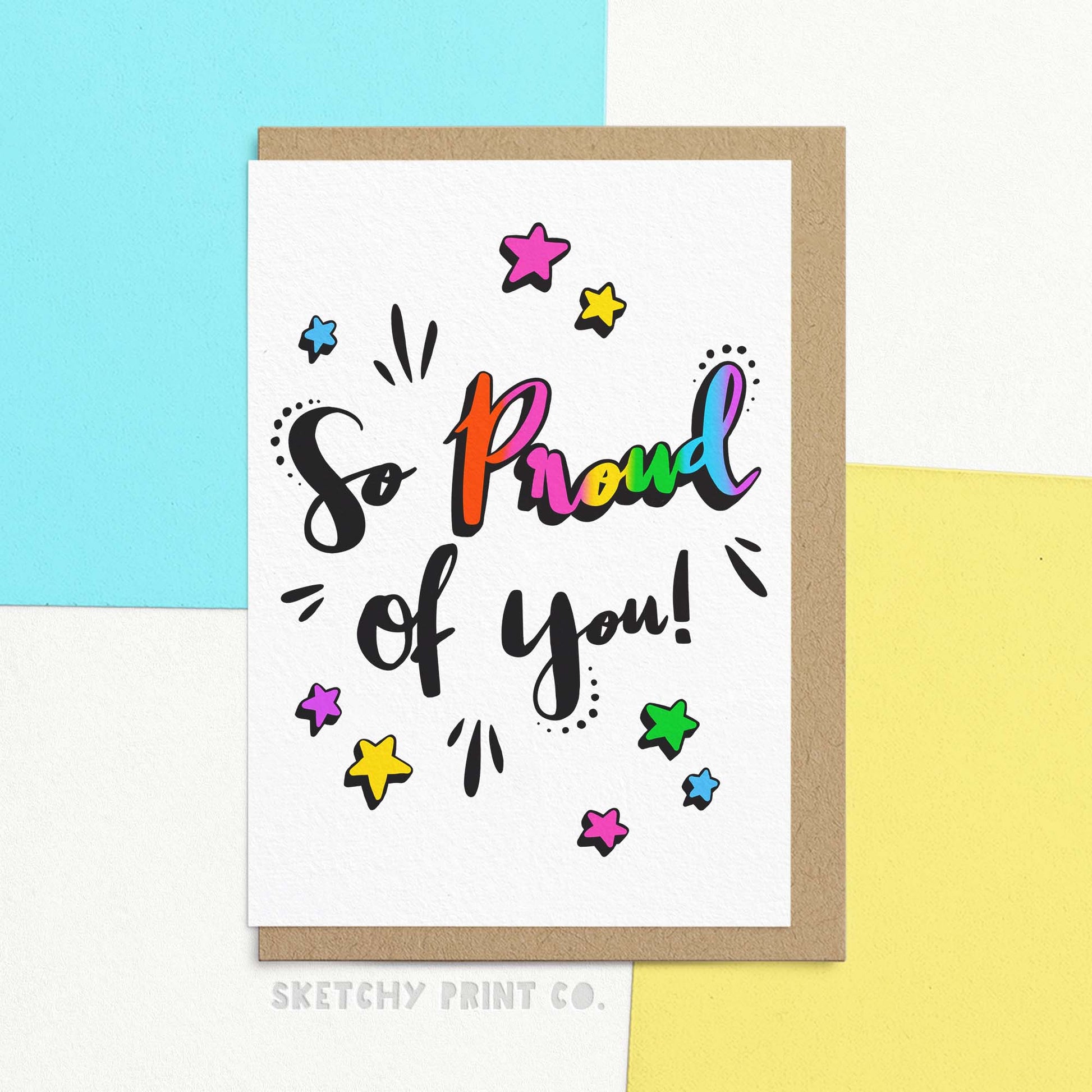 Bright and bold just to say card reading So proud of you! The proud is in rainbow colours. Celebrate a loved one's achievements with our So Proud Of You card! Featuring colourful script and a heartfelt message, this card is the perfect way to express your pride and support. Congratulate them or just share some love with our fun and bold design!