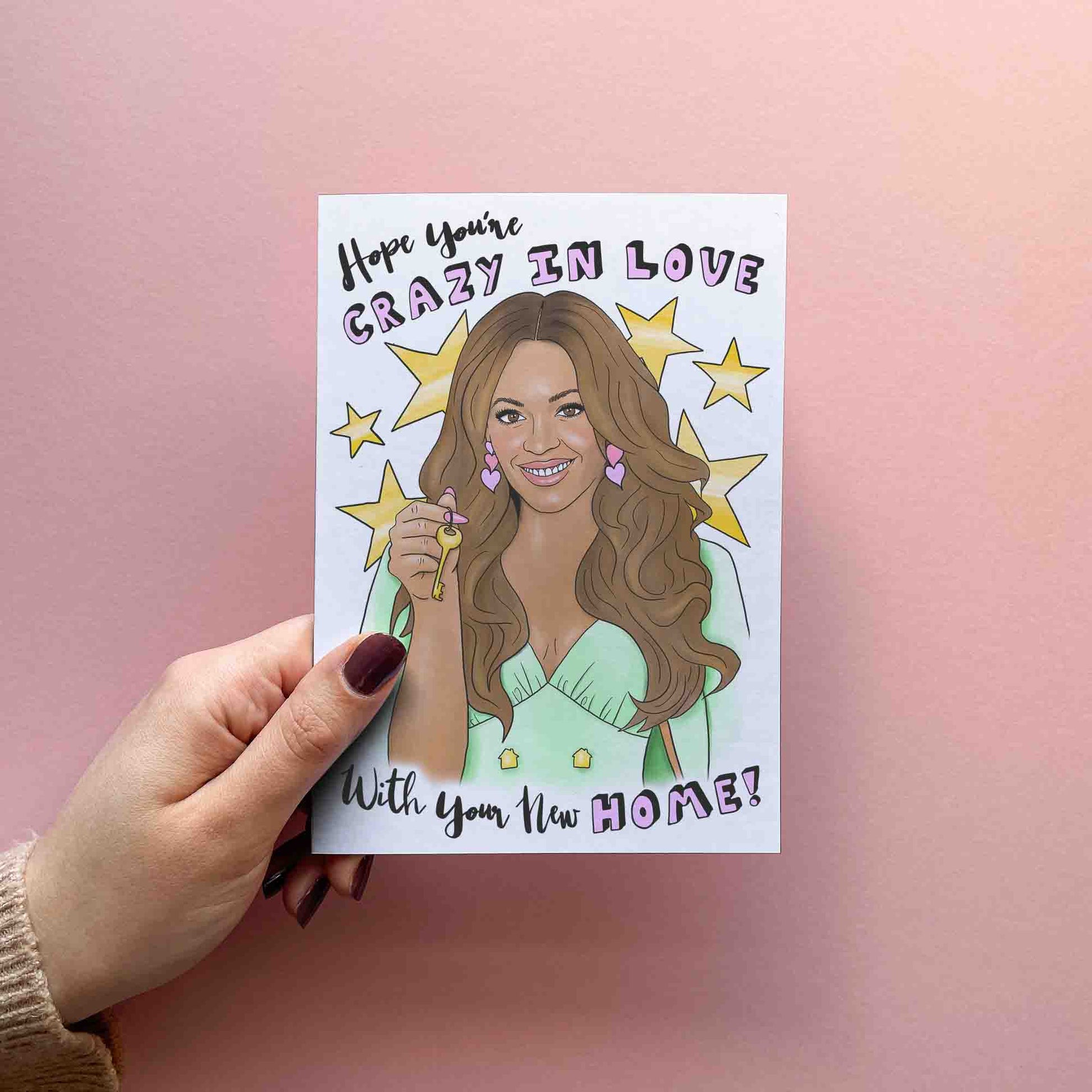 Funny new home / housewarming card reading hope you're crazy in love with your new home! Featuring an illustration resembling Beyonce holding house keys