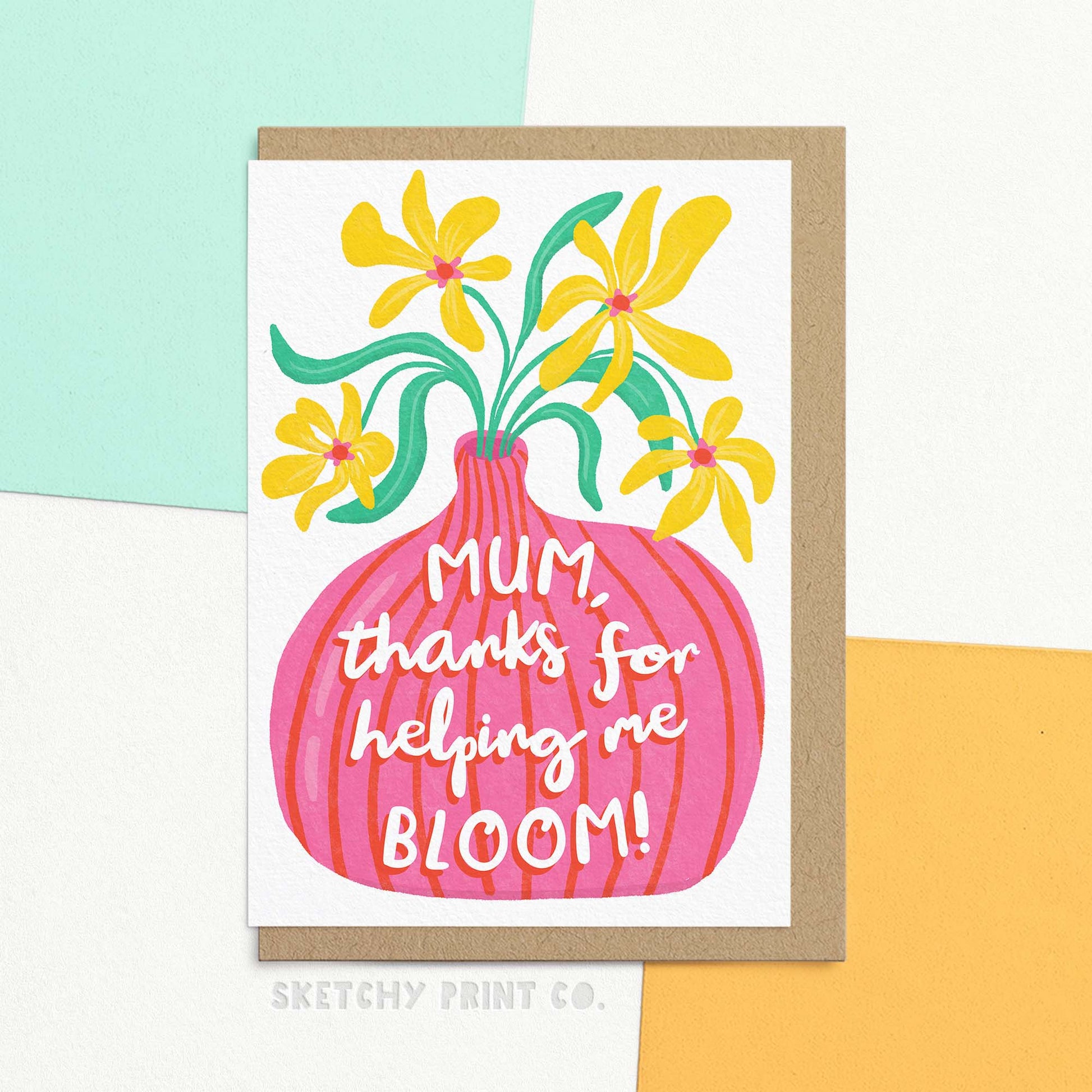 Cute Mothering Sunday card for mum featuring a modern and colourful hand-drawn illustration of a vase of flowers with the words "Mum, thanks for helping me bloom!" written on top. Card is shown with a brown recycle Kraft envelope.